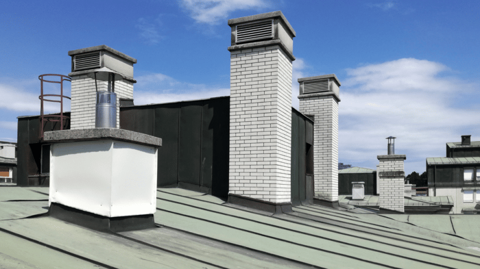 commercial roof with exterior vents and gutter guards