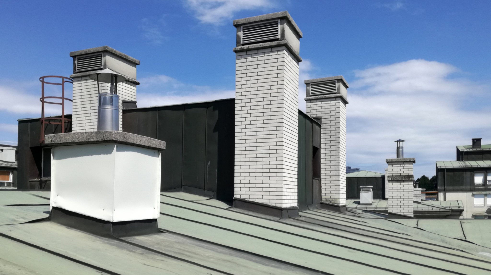 commercial roof with exterior vents and gutter guards